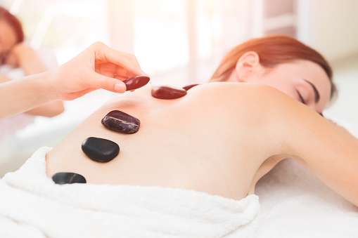 Hot And Cold Stones Massage In Spa For Back Pain Relief ...