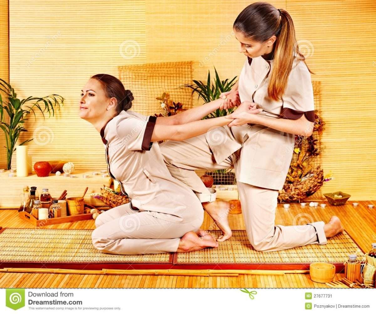 Therapist Giving Stretching Massage To Woman. Stock Image